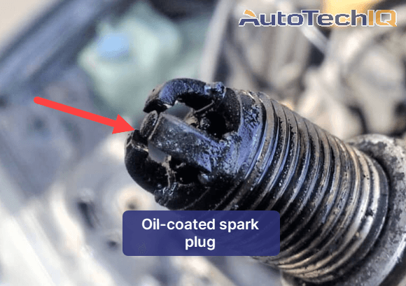 Spark plug malfucntioning because it's coated in oil due to some leak