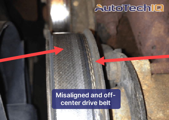 A bad pulley misaligned a drive belt, pushing it off-center