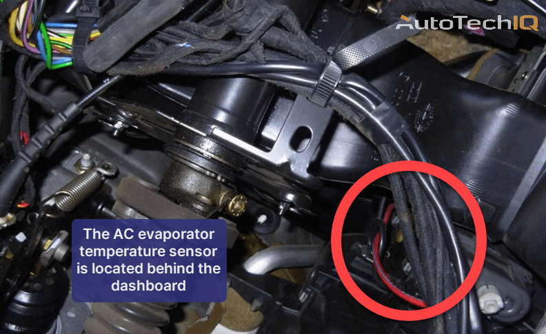 The AC evaporator temperature sensor is found behind the vehicle's dashboard
