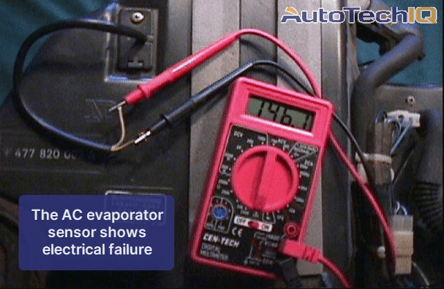 The AC evaporator temperature sensor shows electrical failure. The mechanic used a tool to measure current, and it shows a faulty connection