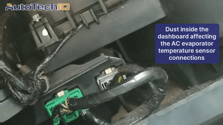 Dust building up under the dashboard and affecting the connections of the AC evaporator temperature sensor