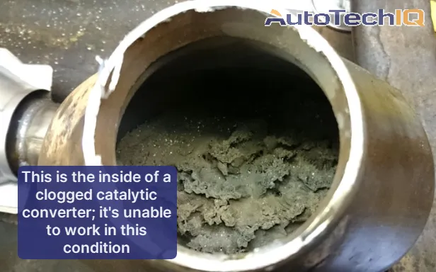 Inside view of a clogged catalytic converter that won't be able to work until it's either cleaned or replaced