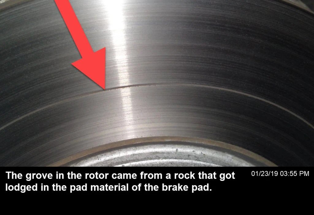 Brake pad damage caused by debris entering the brake system, between the rotors and the pads