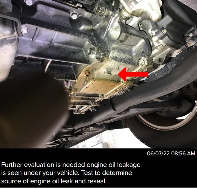 Oil leaking under the vehicle's engine, causing oil to puddle up below the vehicle or burn on hot car poarts, releasing a burning smell