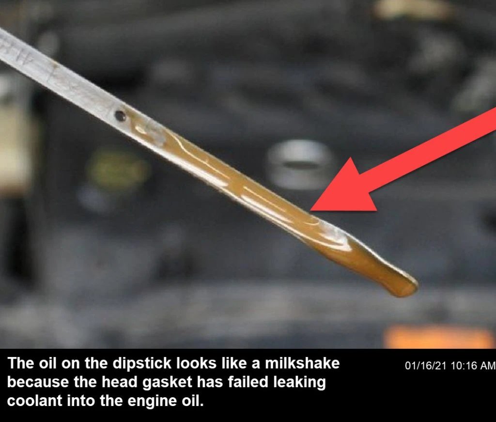 The dipstick shows a very brownish milkshake-like oil. This indicates the head gasket is leaking, allowing coolant to mix with engine oil