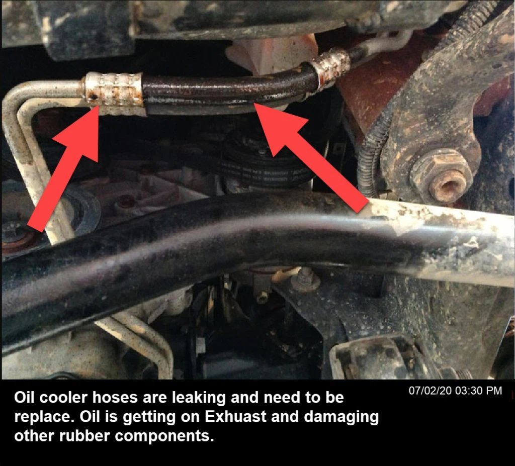 Oil cooler hoses discharging, allowing oil to seep into hot car components and burn, releasing a burning oil smell